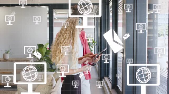 Icon popping by man causing monitor or globe icons floating, team viewing tablet and cell for busine
