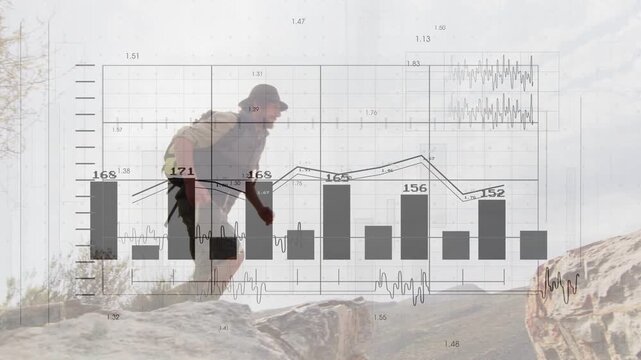Male hiker entering frame, climbing ledge and leaping gap to reach ridge while data charts tracking