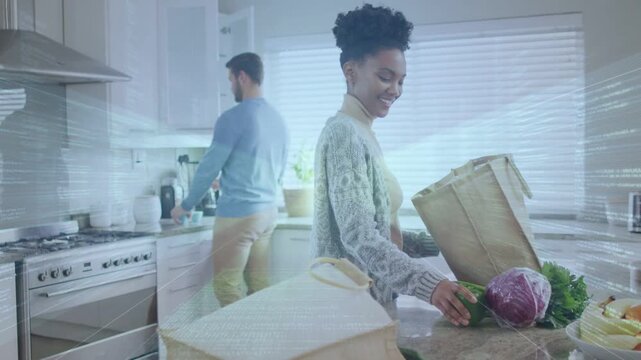 Woman opening bag, unpacking produce in kitchen for dinner; man using faucet, animated tags aiding