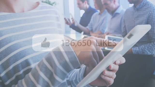 Man tapping tablet, social media overlay appearing, likes rising into hundredsK for marketing