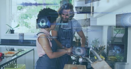 Cooking couple wearing blue-striped aprons stirring saucepan in modern home kitchen with AR overlay © vectorfusionart