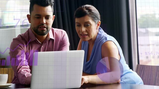 Pair at laptop man pointing causing numbers-to-charts while woman using trackpad analyzing biz data