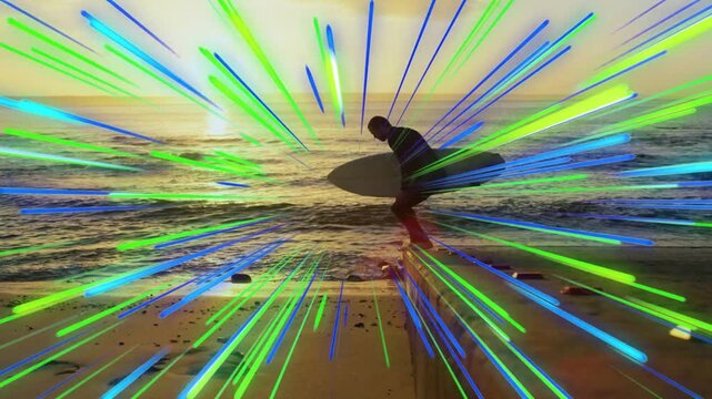 Surfing surfer with board stepping off ledge walking into sea preparing as G or B or C streaks obscu