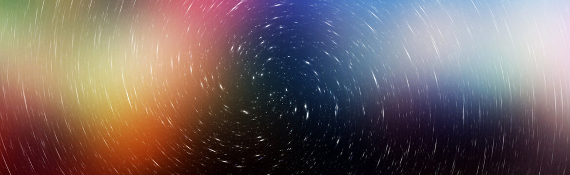 Panoramic abstract background with colorful swirling star trails in the night sky.
