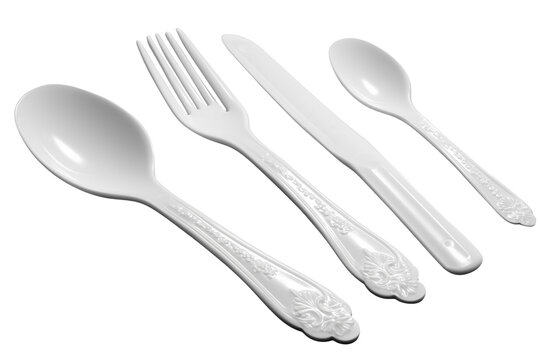 Disposable plastic spoon, knife, and fork in focus isolated on white background png
