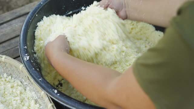 Mashed Cassava Being Mixed by Hand for Traditional Filipino Food Preparation