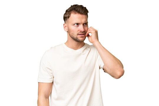 Young blonde caucasian man over isolated background is a little bit nervous