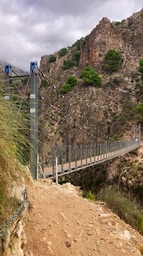 Hiking trail to Colgante bridge (Puente Colgante El Saltillo) over Almanchares river, Sierra Tejeda, Andalusia, Spain