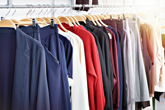 Clothing rack with colorful garments in retail store