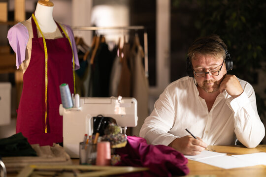 Male tailor draw create sketch of dress