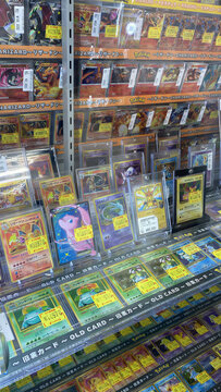 Hamburg, Germany - 04042026: retail display of Pok&eacute;mon trading cards inside a Japanese hobby shop. The image shows neatly arranged single cards in protective sleeves.