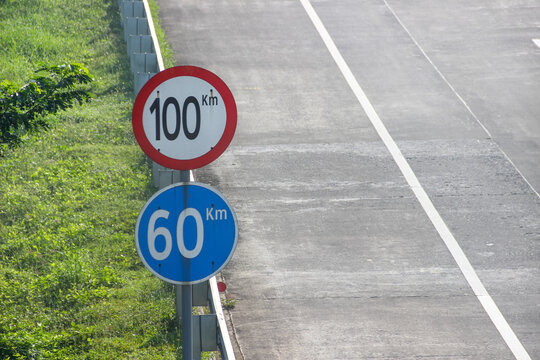 Traffic signs showing maximum and minimum speed limits on toll roads