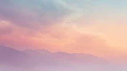 Obraz premium A breathtaking pastel gradient displaying layered distant mountains beneath a soft ethereal twilight sky