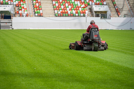 Mowing grass at the football stadium