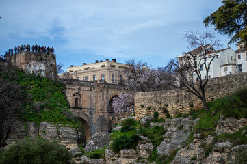 Obraz premium Puente Nuevo dramatic bridge spanning a deep limestone gorge creating iconic architectural landmark in Ronda, Spain.