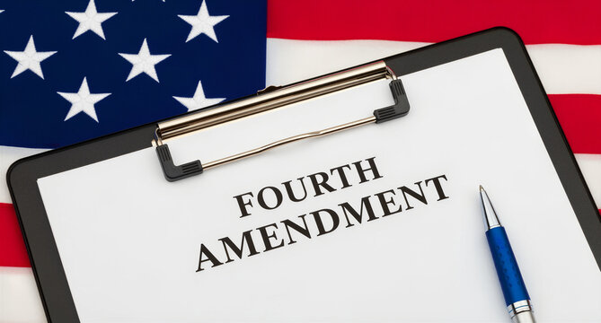 Fourth Amendment text on a clipboard resting on an American flag. Legal document with a blue pen on the side. Constitutional rights and privacy law concept for educational or political use.