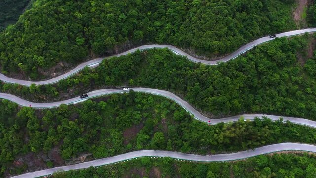 Mountain Road Journey Through Curving Scenic Highland Terrain by Car