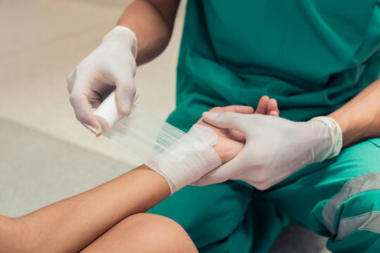 First Aid. Doctors are treating a patient by bandages. Concept first aid and treatment for patients.