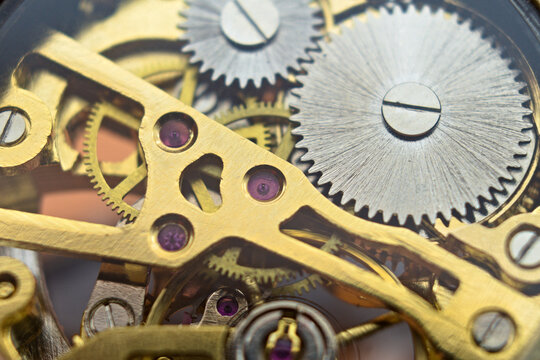 Macro photo of the mechanism of an old mechanical pocket watch