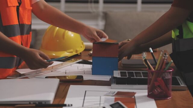 Architecture drawing on architectural project business architecture building construction Colleagues designer Planning Design on blueprint and compasses