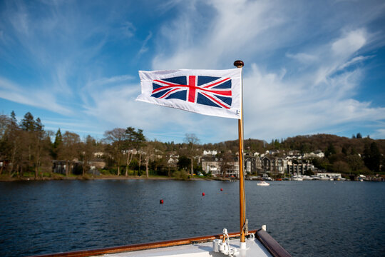 English flag, red cross on white on the Bow of a boat on a lake