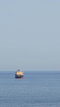 Large crude oil tanker navigating the open sea, symbolizing global trade, energy transportation, international shipping, and the potential for geopolitical tensions and economic conflicts