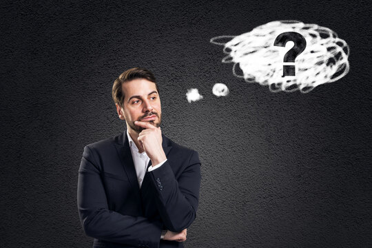 Thoughtful businessman pondering solution with question mark cloud on dark abstract background representing curiosity and problem solving.