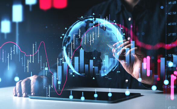 Digital global finance interface with holographic charts, market data visuals, and futuristic analytics displayed over a tablet device.