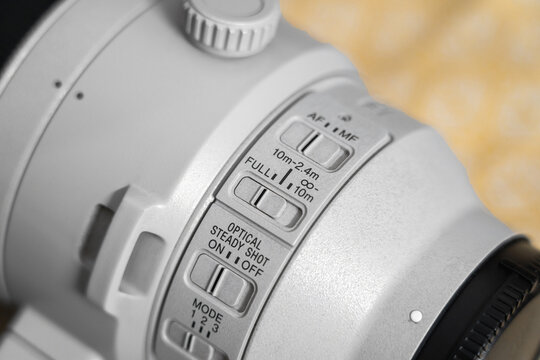 Focus Limiter Switch on a 200mm-600mm Super Telephoto Lens. Close-Up of a Professional Wildlife Photography Camera Lens Control Feature.