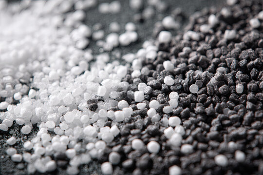 Many white and gray granules of polypropylene, polyamide. Background. Plastic and polymer industry, industry. Microplastic products. 