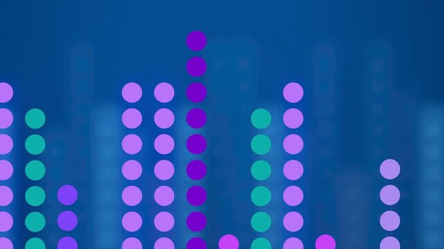 Colorful light display shows sound levels on a digital screen in a music studio during a recording session at night.
