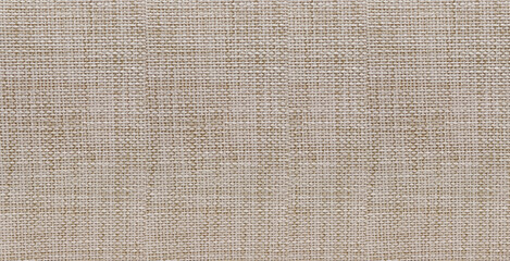 This high-resolution image showcases close-up of beige fabric pattern featuring a tight consistent weave that creates sophisticated tactile texture. The neutral earthy tones and rhythmic interlacing © umaporn