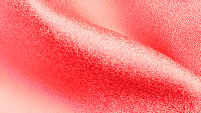 Silk fabric with a gradient pattern in shades of red displayed on a flat surface during daylight hours
