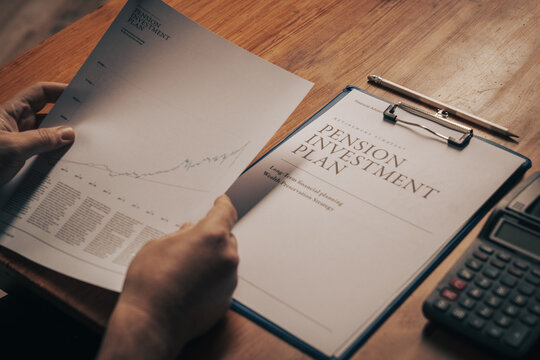 Senior investor reviewing pension investment performance and retirement financial planning document