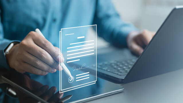 User signing digital document on tablet with stylus, representing privacy consent, data protection, and secure agreement in modern digital compliance system.