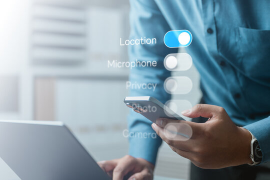 User managing privacy settings on smartphone with permission toggles, illustrating data control, consent management, and mobile security in digital environment.