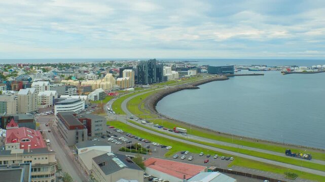 Reykjavik, Iceland. Aerial view of the city center of Reykjavik, Iceland during a cloudy day in summer. Time-lapse with car traffic in downtown, zoom in