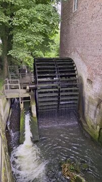 Ribe Watermill Water Wheel with Flowing Spillway, Denmark, Summer