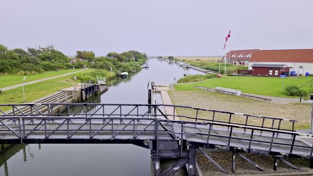 Canal Lock Gate on Ribe River with Danish Flag, Denmark, Summer