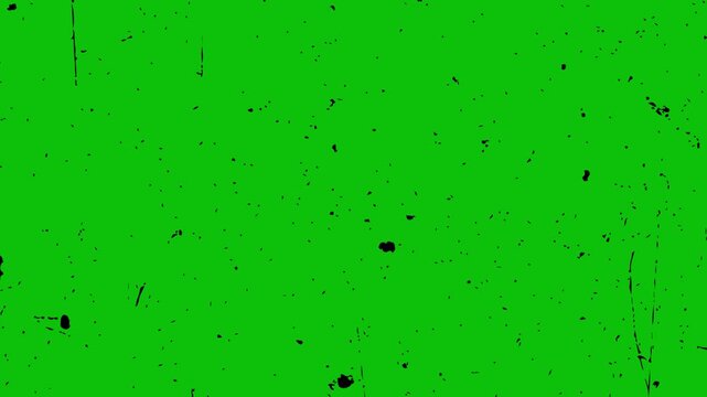 loopable 4k black dust and scratches on green screen background. abstract cinematic black grunge texture on chroma key loop.