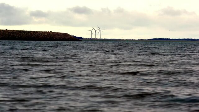 Choppy North Sea Water with Wind Turbines and Breakwater at Esbjerg, Denmark