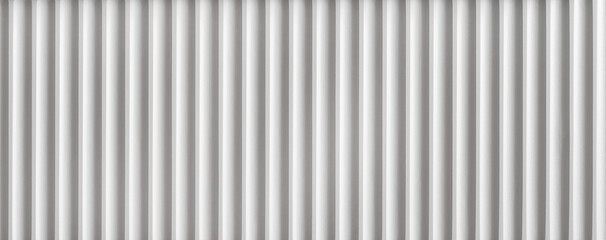 Fototapeta premium Lines of white vertical panels in a modern indoor setting creating a pattern on the wall. setting is likely for modern architecture.