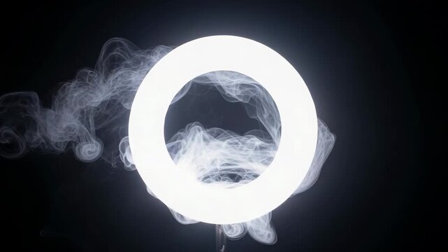 Cinematic white smoke ring portal effect on black background