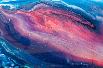 Naklejka premium Colorful abstract art created with fluid paint techniques on a canvas during daylight