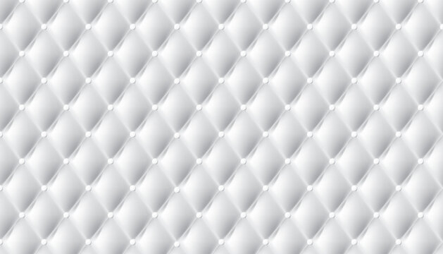 Seamless white tufted background pattern with soft padded diamond shapes and decorative buttons.