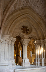 Fototapeta premium Arches and ornamental details of the historic Piedra Monastery. Ancient religious architecture with natural light and stone textures, Zaragoza, Spain