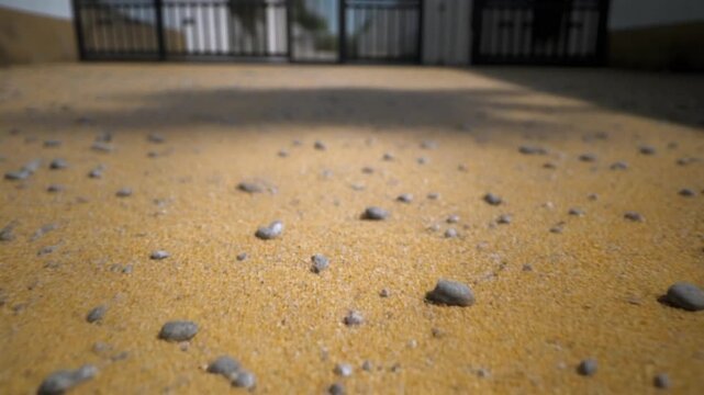 Close Up Outdoor Ground With Sand Pebbles And Shadows.