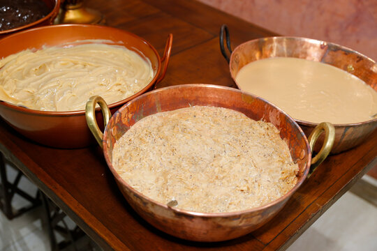 Creamy Coconut Cocada Dessert Served in Rustic Copper Pots for Gourmet Catering