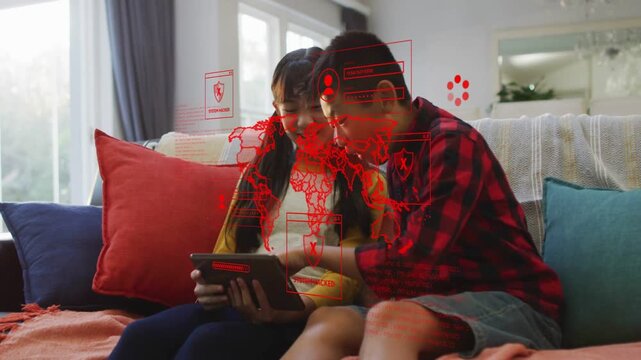 Girl turning tablet so siblings seeing screen, boy tapping and leaning in, education tech learning
