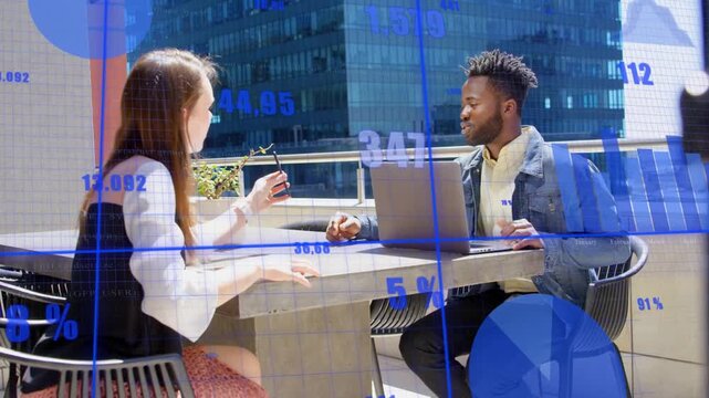 Rooftop duo bumping fists, inspecting plant, tapping laptop, blue charts overlaying business data
